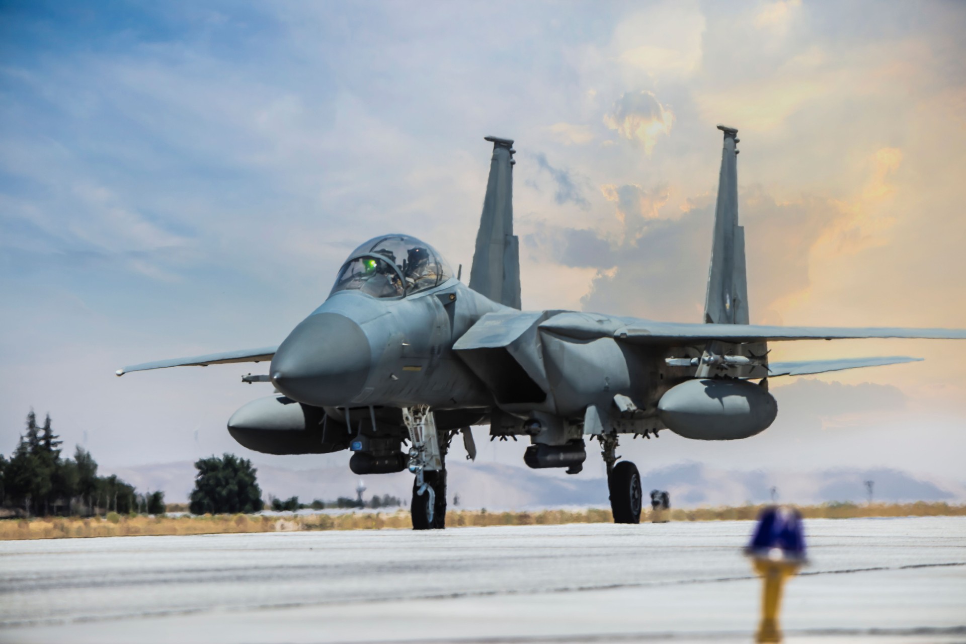 F-15 Eagle FighterJet on runway  at sunset