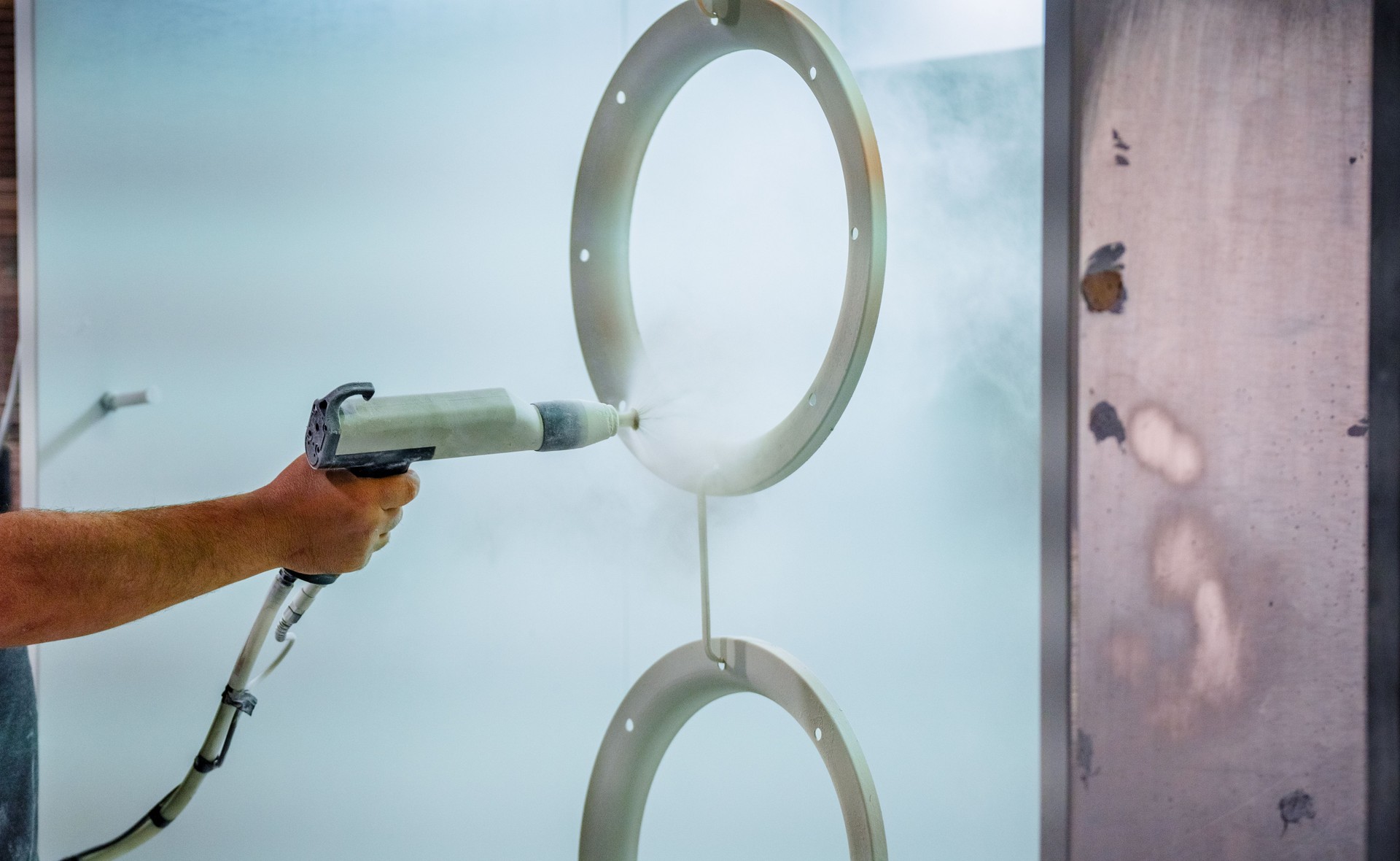 powder coating process being applied to a metal ring