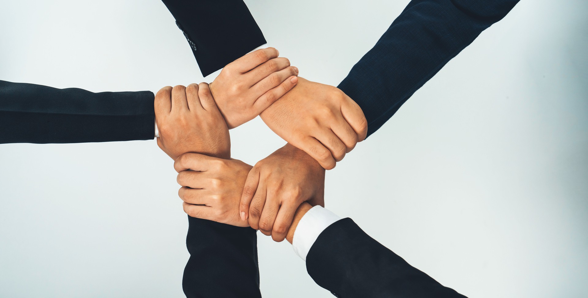 Office worker team stacking hand together symbolize successful teamwork. Shrewd